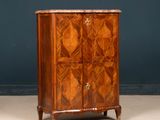 an antique wooden cabinet with a marble top and two doors