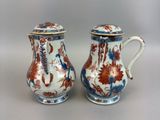 pair of antique chinese vases with blue and red designs on them