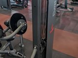 an image of a gym room with machines and weights