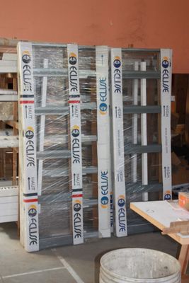 many stacks of boxes stacked on top of each other in a warehouse