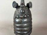 an image of a sculpture of a face with horns on it