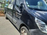 a black van that is parked on the side of the road