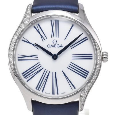 a close up of a watch with roman numerals on the face
