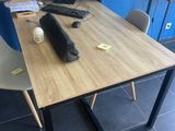 a desk with a computer, keyboard, mouse and mouse on it