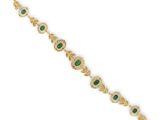 a gold bracelet with emerald stones and diamonds