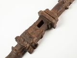 an old wooden object on a white surface with a white background