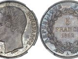 a close up of a silver coin with a woman ' s face on it