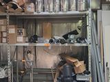 a room filled with lots of metal pipes and other items