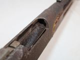 a close up of a gun that is on a table