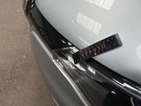 a sticker on the hood of a car that says october