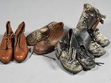 several pairs of shoes are lined up on a white surface