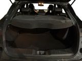the back of a car with its trunk open and the back seats down