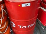 a red barrel sitting next to a stack of life preservers