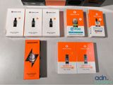 boxes of electronic devices sitting on top of a table next to each other