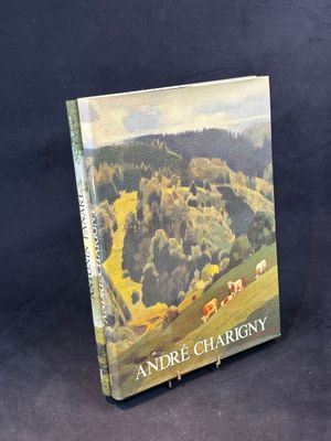 un livre dont la couverture représente un paysage