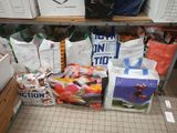 many bags of food sitting on a shelf in a store