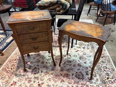 two wooden tables with drawers on them in a room