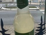 a bottle of beer sitting on top of a cardboard box