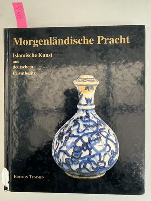 a book with a picture of a blue and white vase on it
