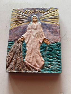une photo d'un carreau sur lequel figure une image de Jésus