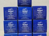 six boîtes de savon bleu posées sur une table