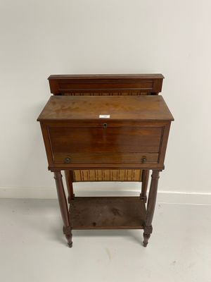 an old wooden desk with a drawer on top of it