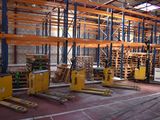 a large warehouse with pallets and pallets in it