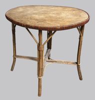 Table en rotin, plateau oval cerclé de bandes oranges et noi… (photo 2)