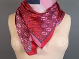 a close up of a mannequin torso with a red scarf on it