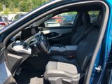 the interior of a blue car with the driver ' s seat up