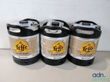 three kegs of coffee sitting on a counter top next to each other
