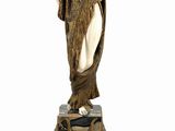 an image of a statue of a woman holding a fan