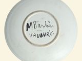 a white plate with a black writing on it