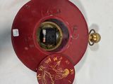 a red clock that is on a white table