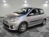a picture of a small silver car parked on a checkered floor