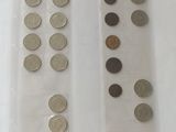 two bags of coins sitting on a table next to each other