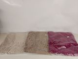 four different colors of fabric on a white surface