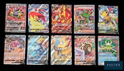 Les cartes Pokémon sont alignées sur une surface noire.