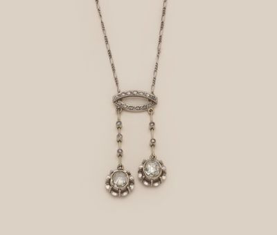 an image of a necklace and earrings with diamonds on a white background