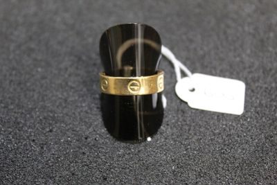 a ring that is on a black surface with a price tag