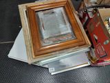 a picture of a picture frame sitting on top of a pile of other items
