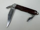 a knife that is laying on a table