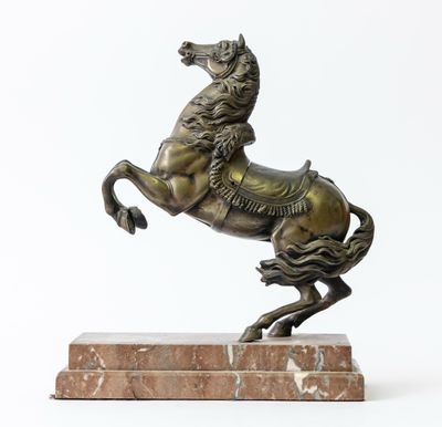 bronze statue of a horse on a marble base on a white background