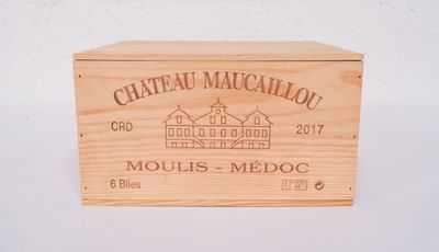 wooden box with a logo of chateau macallaou on it