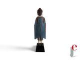 a small statue of a person wearing a blue robe