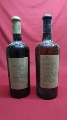 two bottles of wine sitting on top of a red cloth