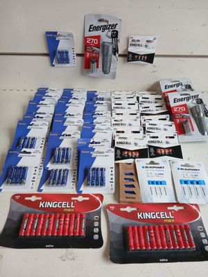 a lot of batteries that are on the table