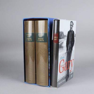 two books in a blue box with a picture of a man in a suit and tie