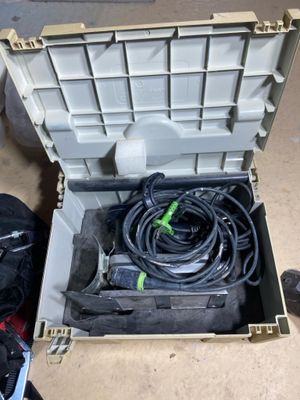a tool box with a hose and a tool in it