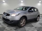 the silver nissan qx is parked in a room with a checkered floor